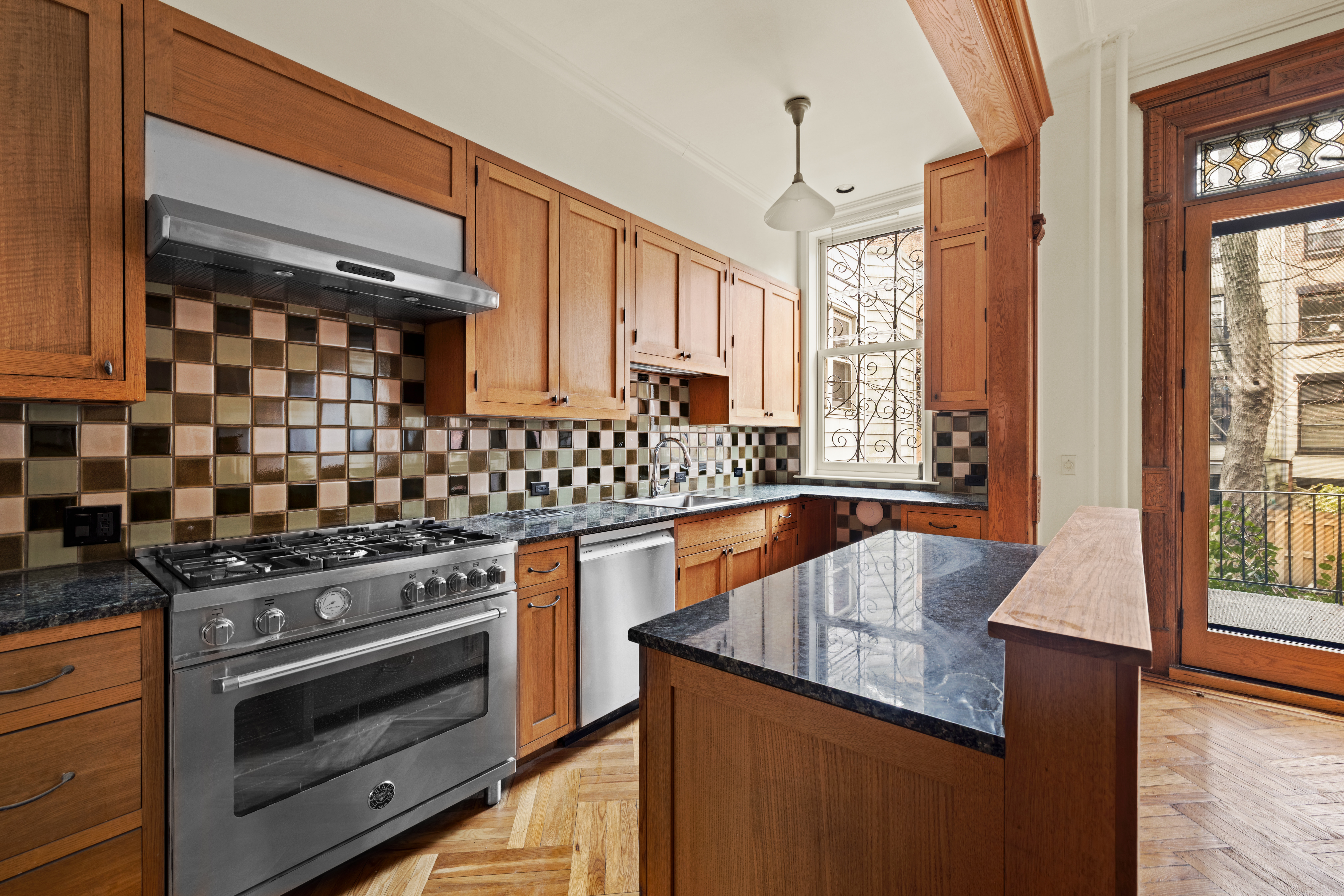 906 President Street, Unit 1 Brooklyn, NY 11215 - Photo 5 of 18 a kitchen with granite countertop a stove and a sink
