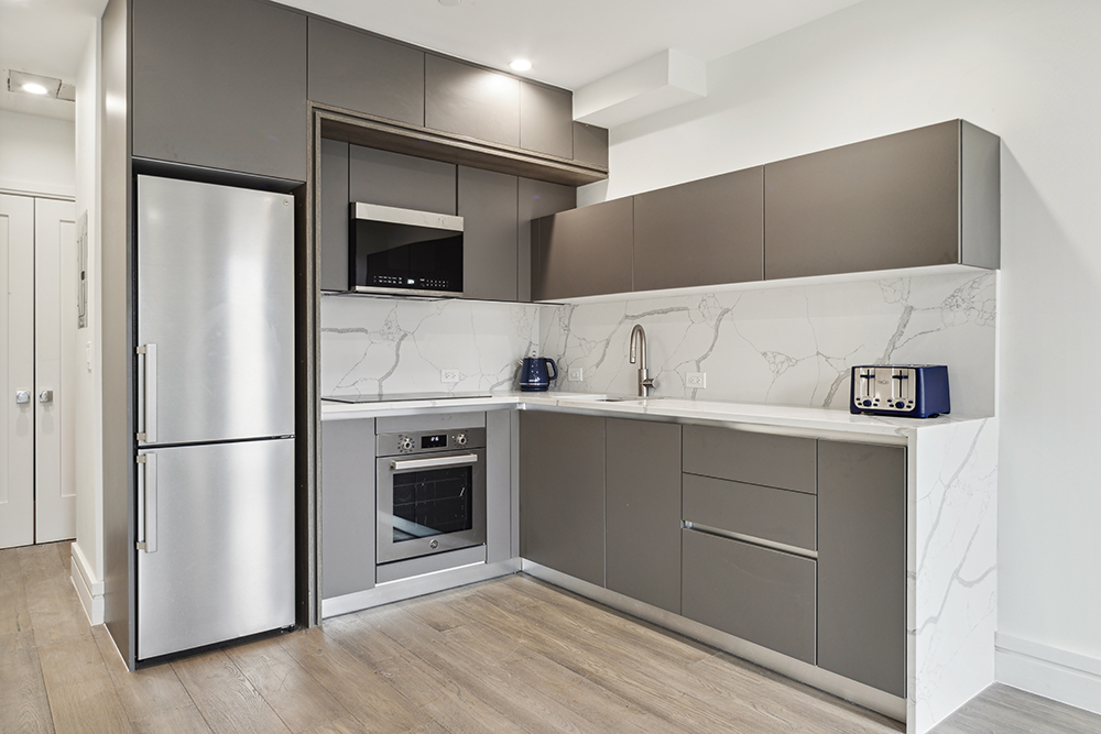 143 Winthrop Street, Unit 3C Brooklyn, NY 11225 - Photo 2 of 9 a kitchen with cabinets and stainless steel appliances