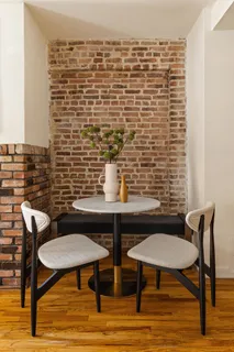 a view of a chairs and table in a patio