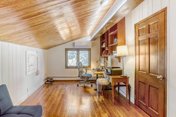 a front view of a house with outdoor seating