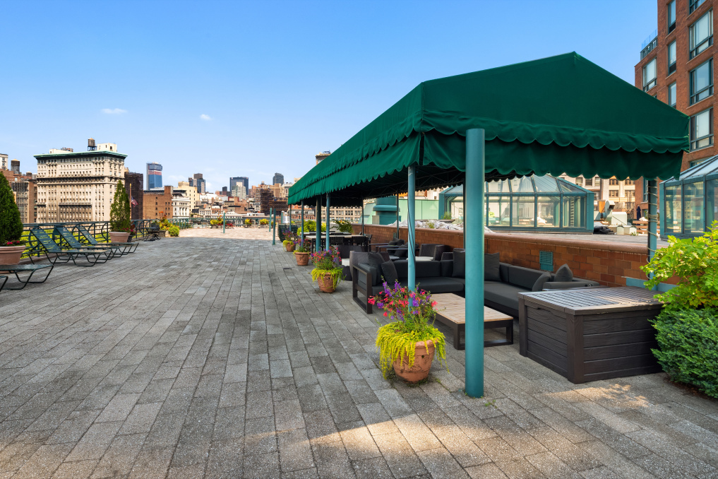 1 Irving Place, Unit V9D Manhattan, NY 10003 - Photo 2 of 7 a view of a swimming pool with chairs in patio