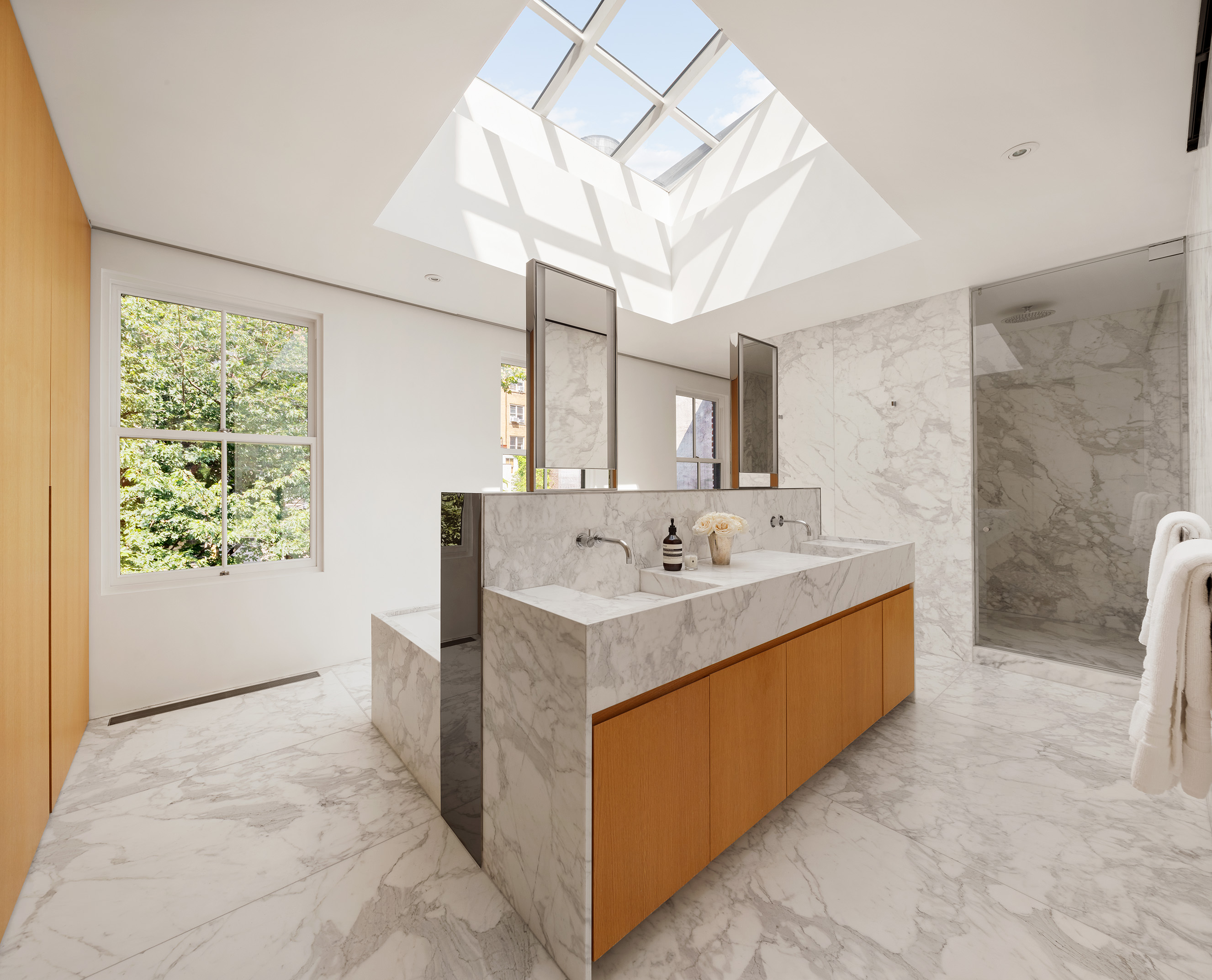 55 West 9th Street Manhattan, NY 10011 - Photo 16 of 20 a bathroom with a sink a bathtub and a mirror