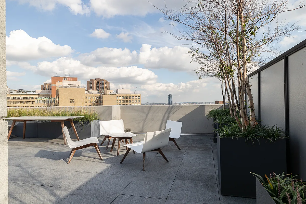 385 1st Avenue, Unit 10G Manhattan, NY 10010 - Photo 14 of 22 a view of a terrace with furniture and a fire pit