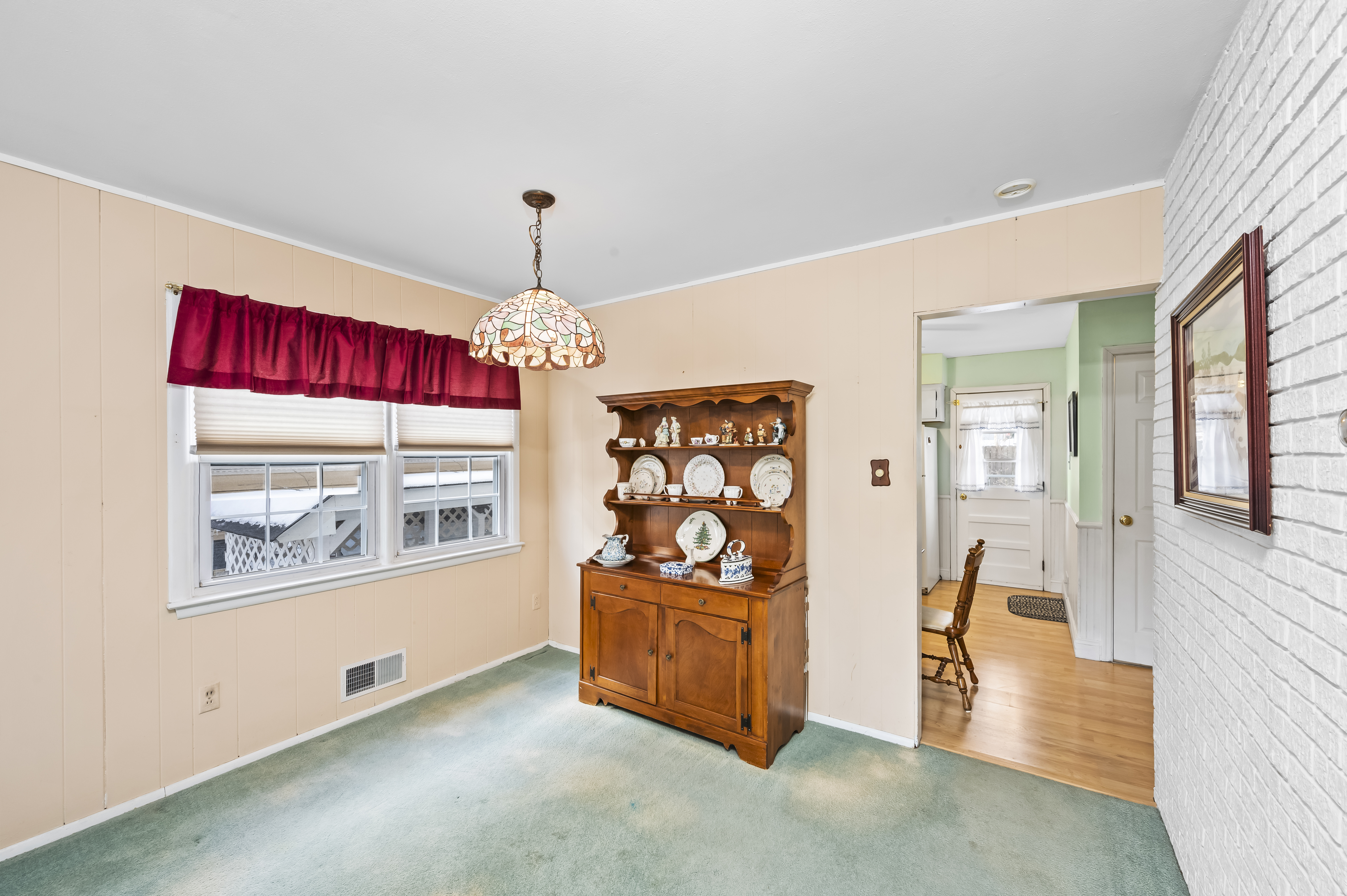 15 Area Place Staten Island, NY 10314 - Photo 7 of 27 a living room with stainless steel appliances kitchen island granite countertop furniture and a window