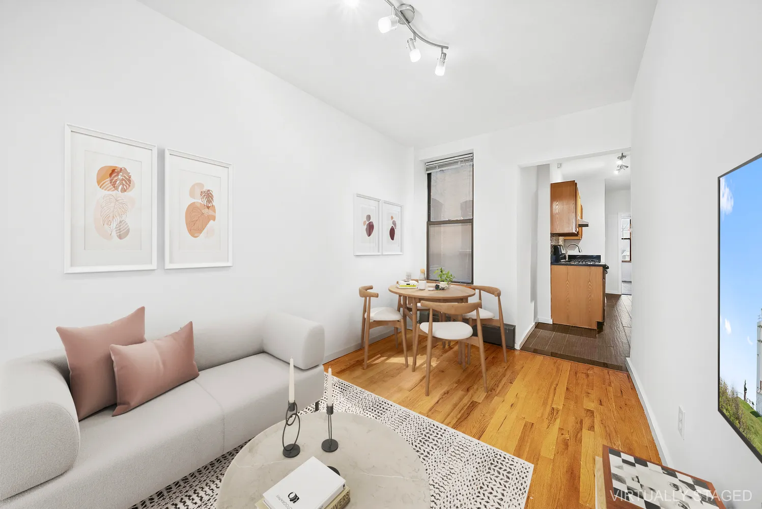 a living room with furniture and wooden floor