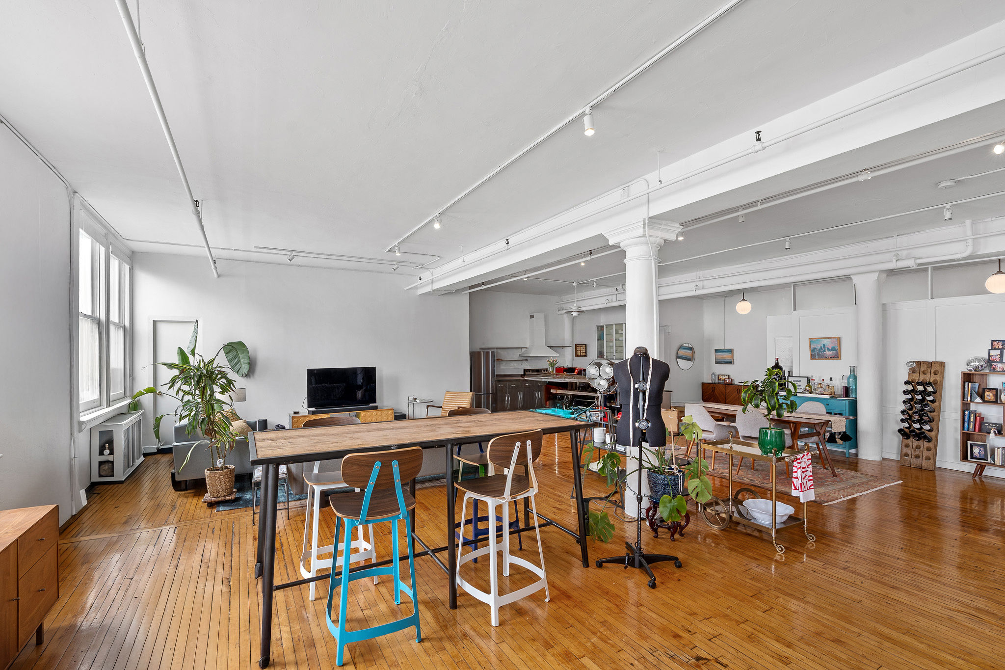 565 Broadway, Unit 8W Manhattan, NY 10012 - Photo 19 of 23 a view of a dining room with furniture wooden floor and next to a window