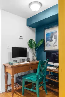 a view of a workspace with furniture