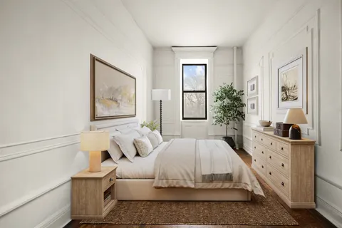 a large white bed in a white room