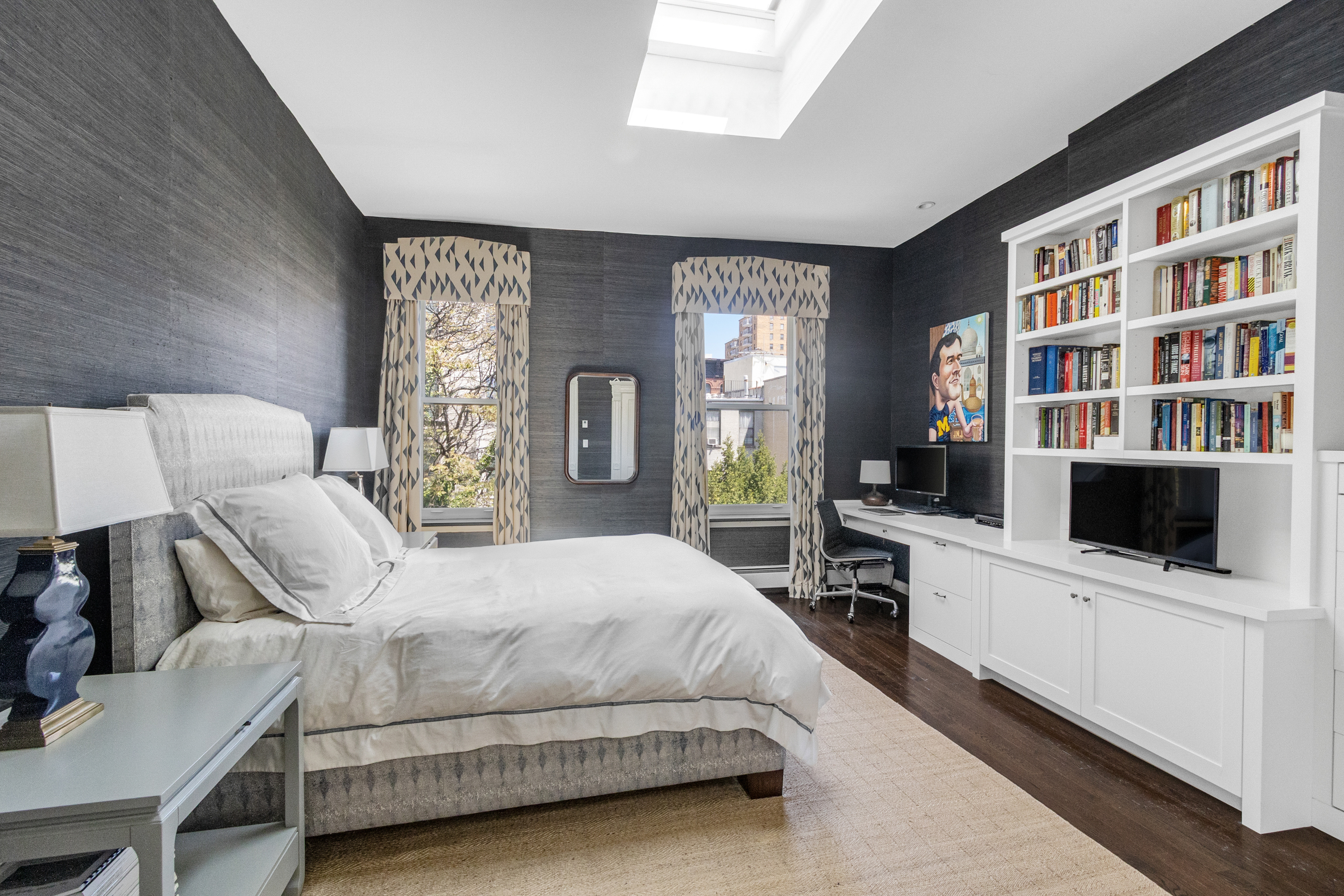 125 West 132nd Street Manhattan, NY 10027 - Photo 10 of 21 a bedroom with a large bed and a bookshelf