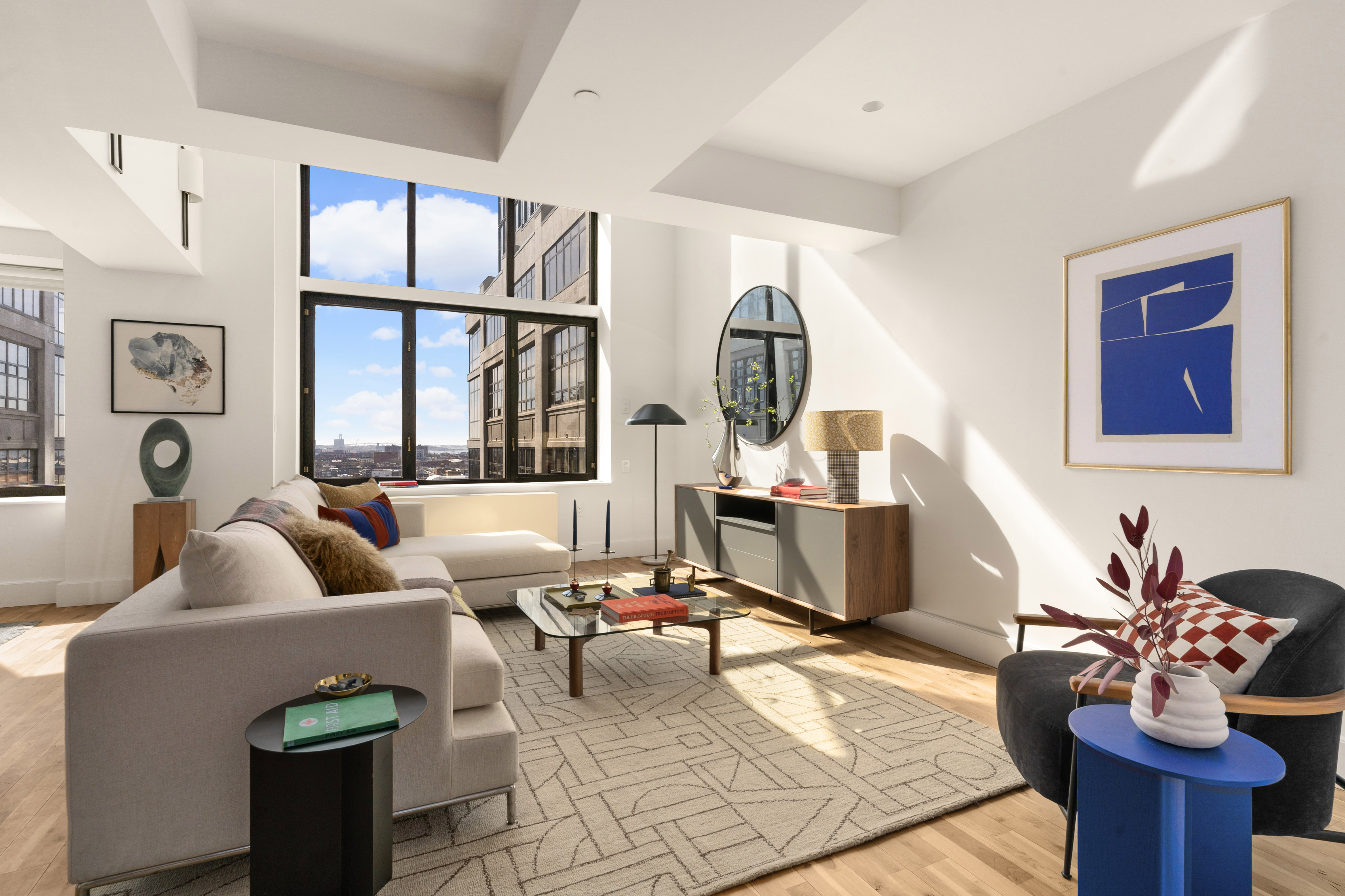 360 Furman Street, Unit 1041/1042 Brooklyn, NY 11201 - Photo 2 of 30 a living room with furniture fireplace and a large window