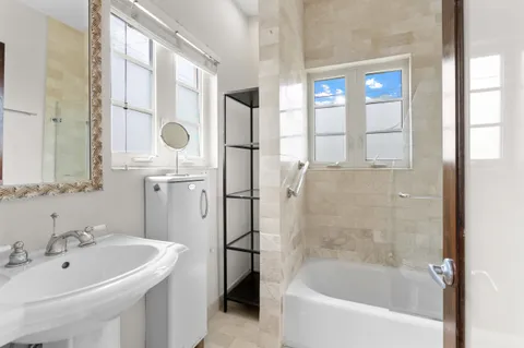 a bathroom with a bathtub and a sink