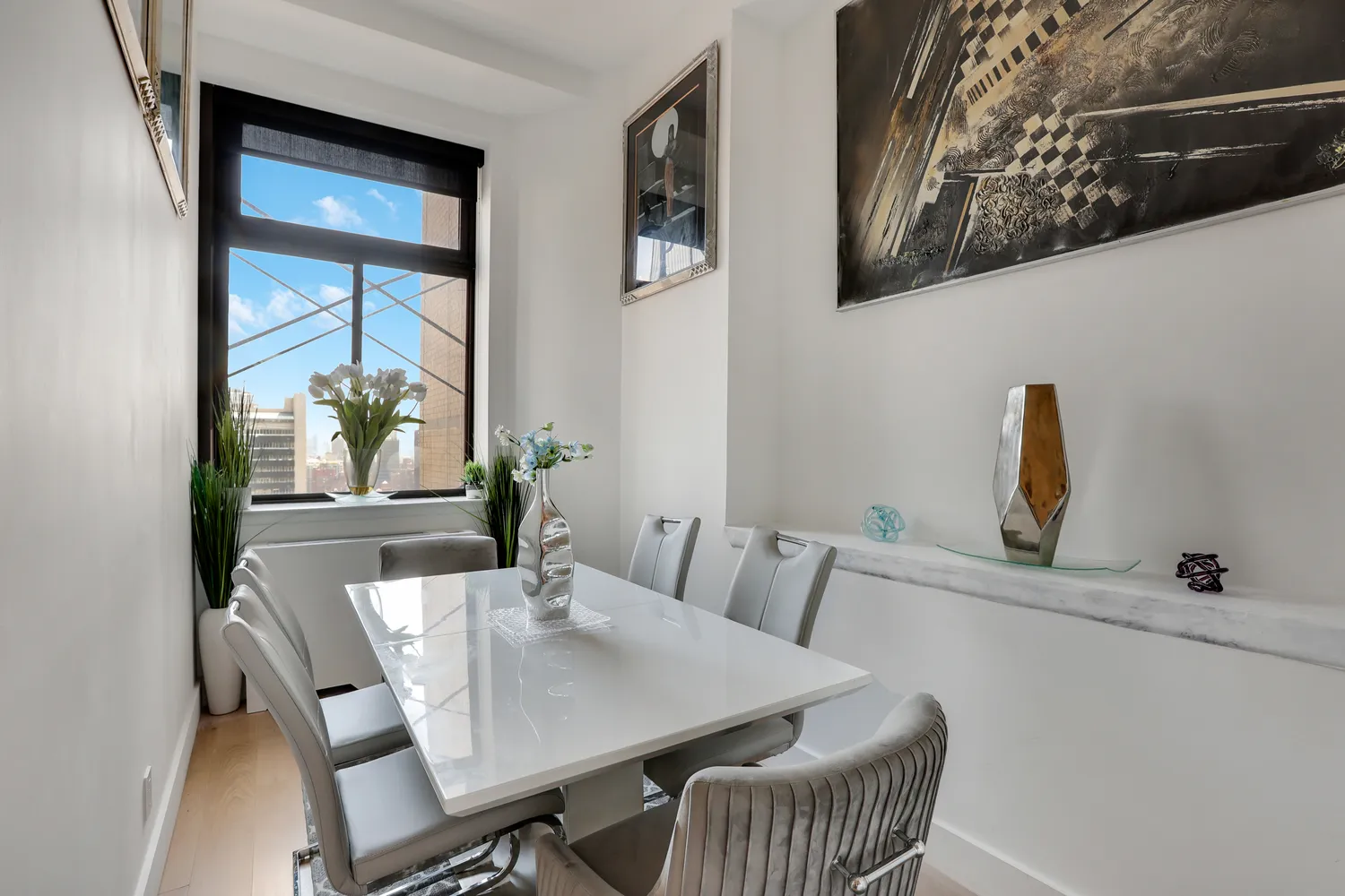 a view of a dining room with furniture and window