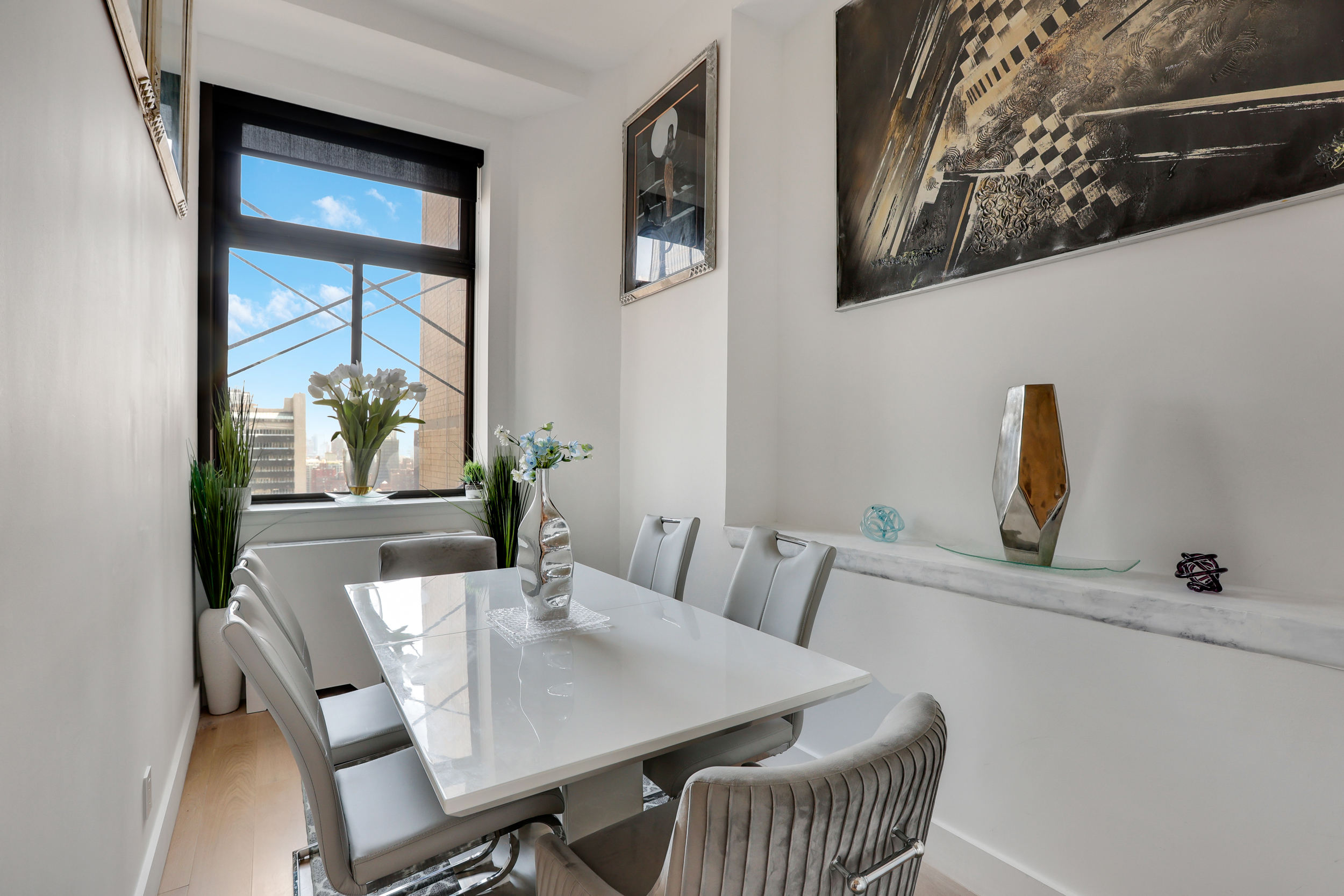 310 East 46th Street, Unit 20H Manhattan, NY 10017 - Photo 6 of 9 a view of a dining room with furniture and window