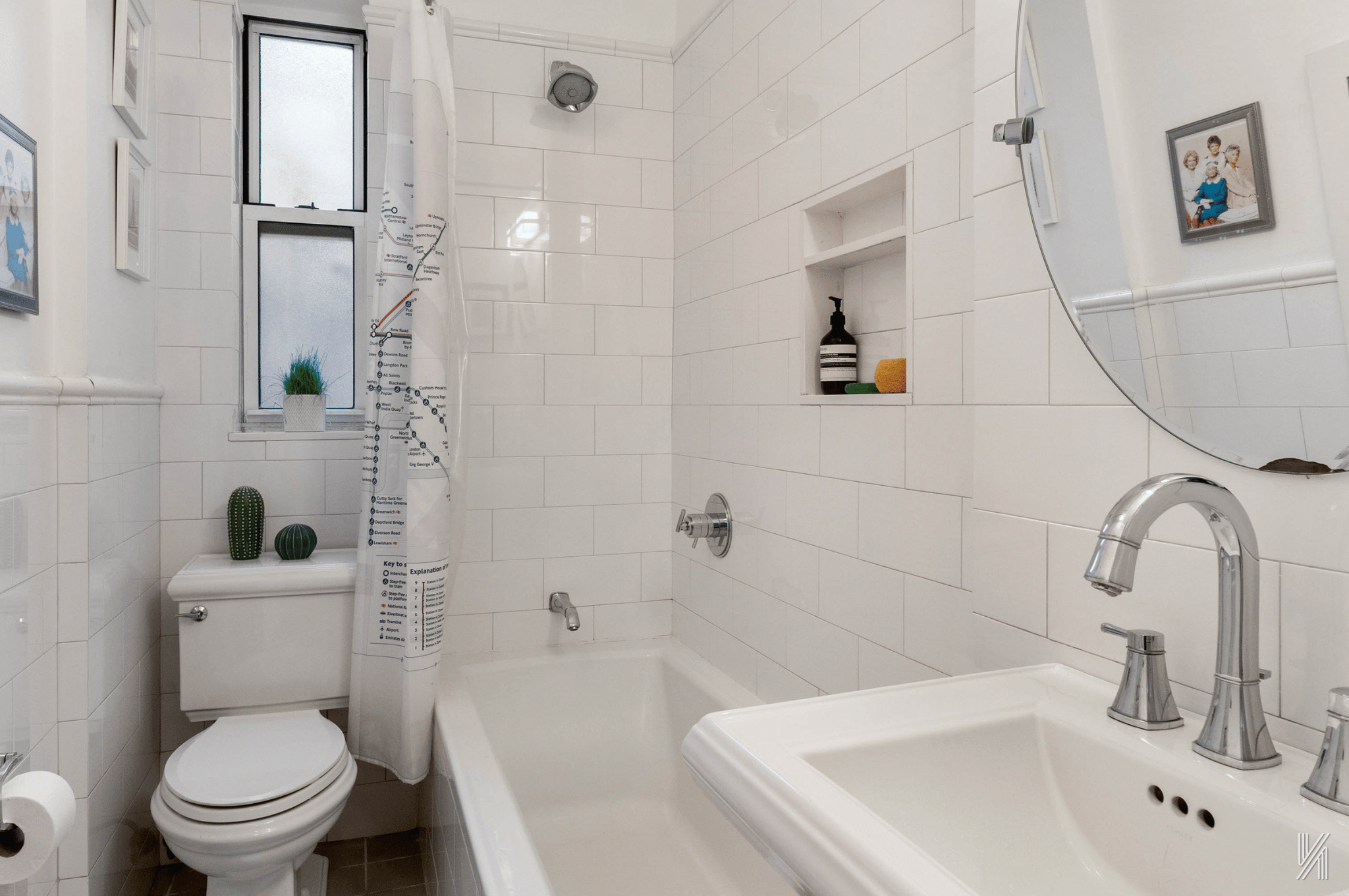 73-12 35th Avenue, Unit E23 Queens, NY 11372 - Photo 12 of 16 a bathroom with a sink toilet and shower