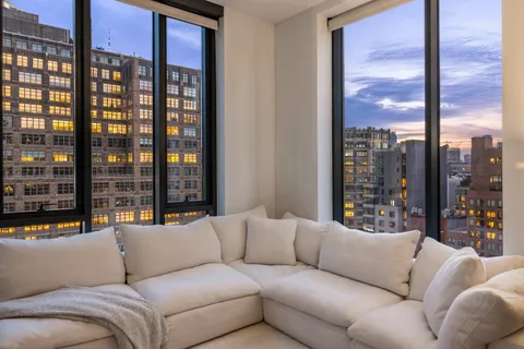 a living room with furniture city view