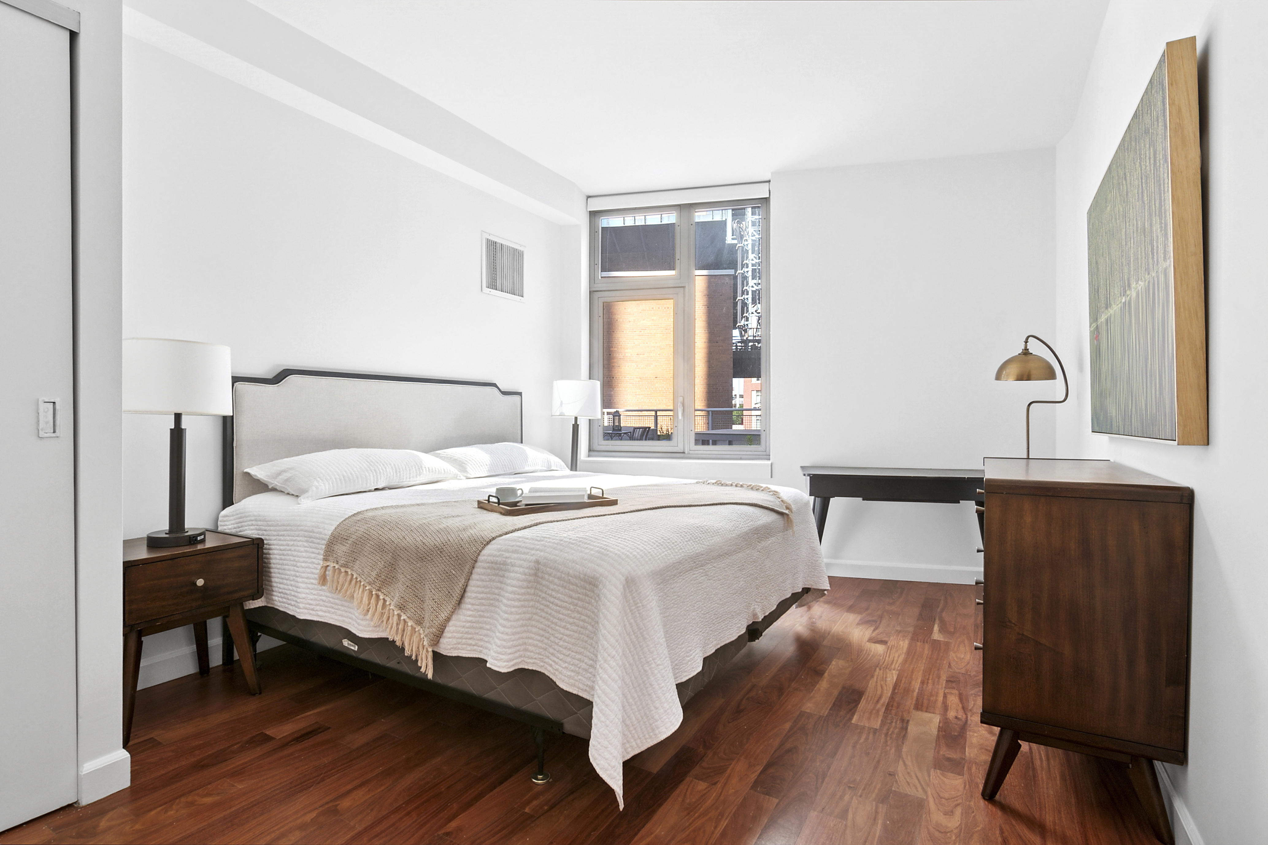 100 Jay Street, Unit 4H Brooklyn, NY 11201 - Photo 5 of 13 a bedroom with a bed and wooden floor