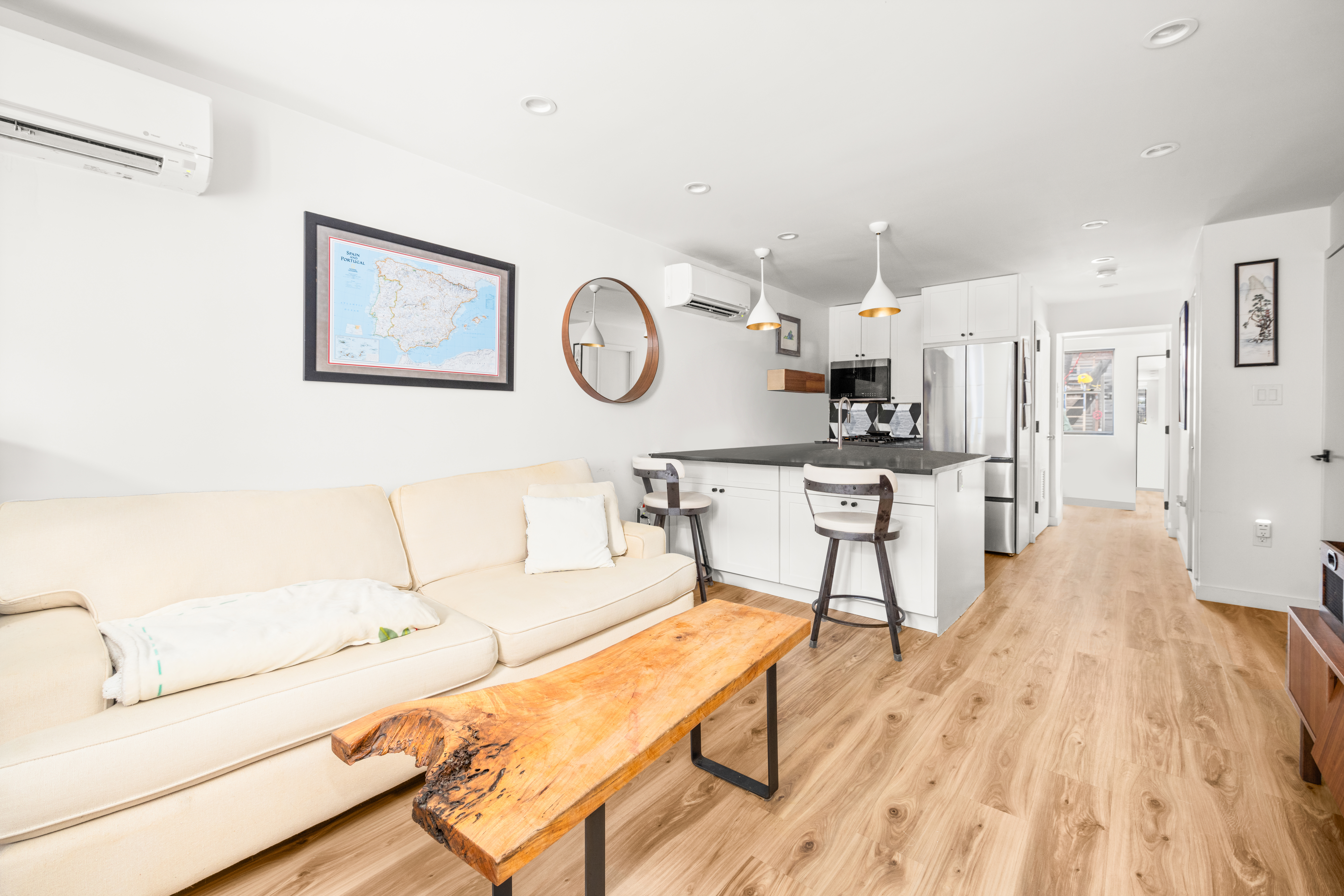 211 14th Street Brooklyn, NY 11215 - Photo 13 of 18 a living room with furniture and kitchen view