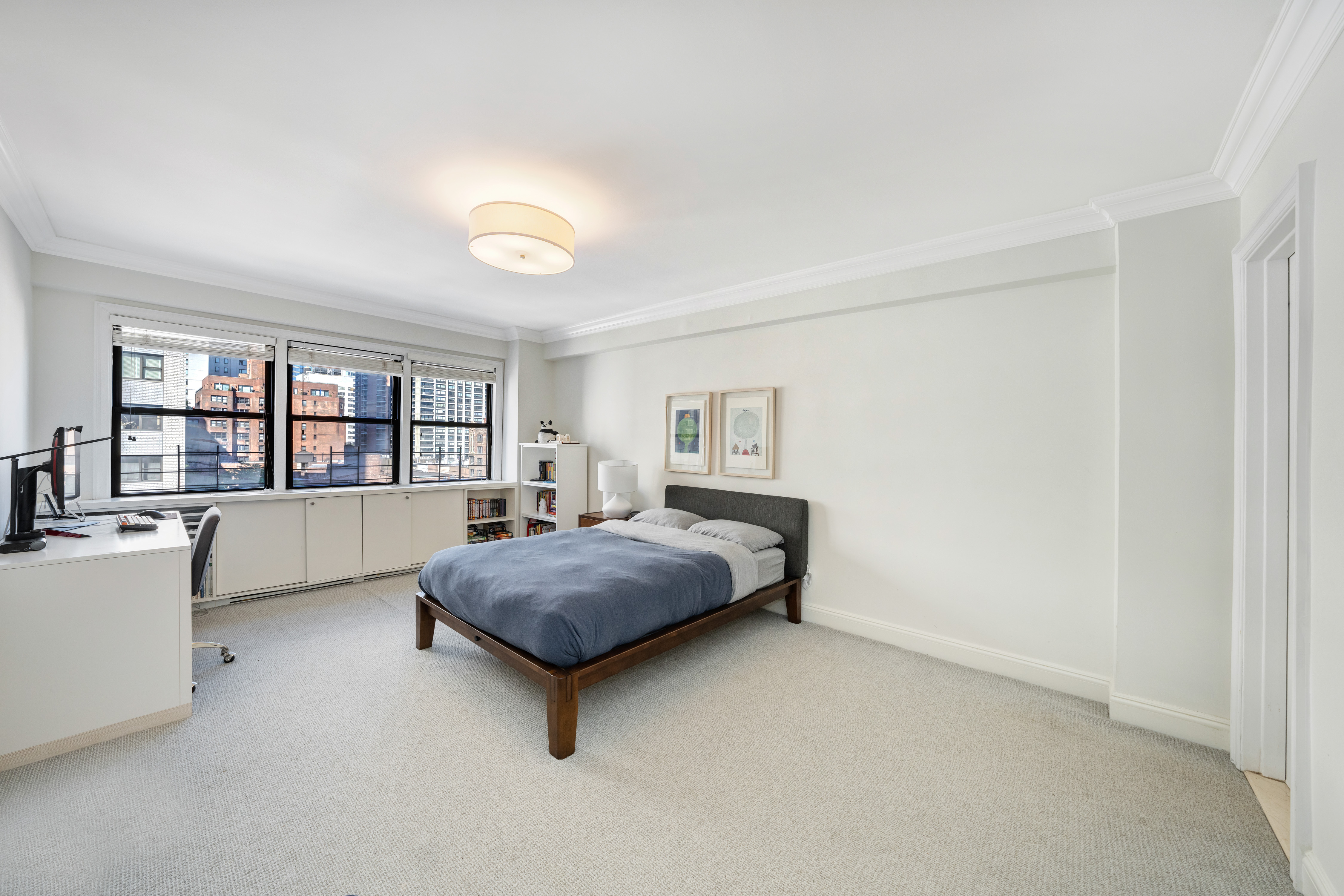 411 East 57th Street, Unit 11AB Manhattan, NY 10022 - Photo 10 of 17 a bedroom with a large bed and a window