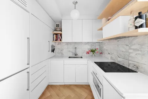 a kitchen with a sink and cabinets