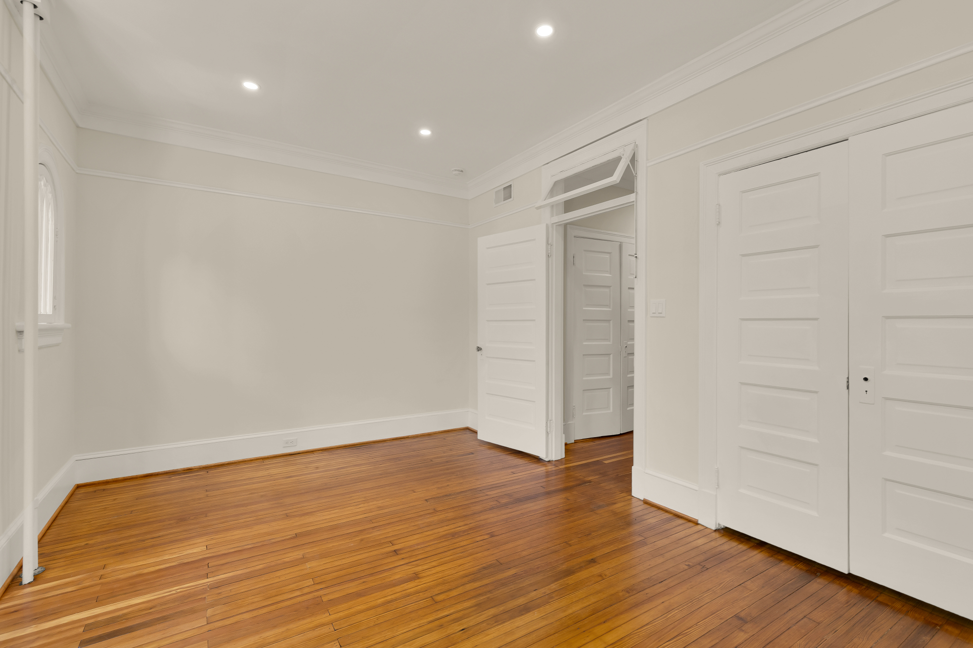 1737 Park Road Northwest Washington, DC 20010 - Photo 27 of 32 a view of an empty room with wooden floor