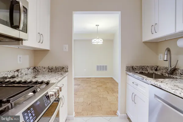 a view of a bathroom from a hallway