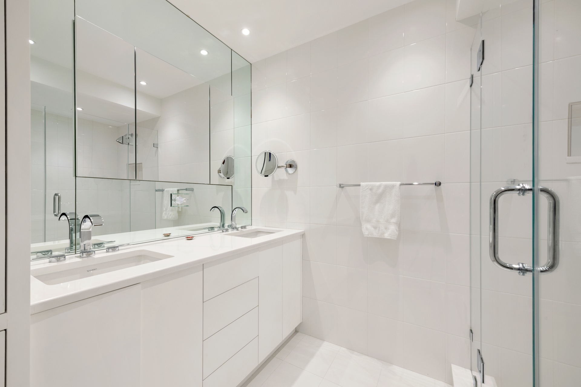 150 East 69th Street, Unit 7K Manhattan, NY 10021 - Photo 9 of 22 a bathroom with a double vanity sink mirror and double