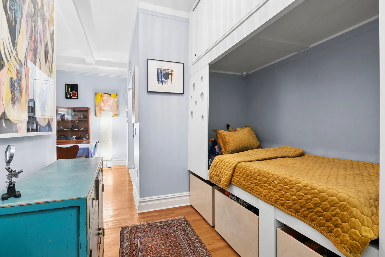 a bedroom with a bed and a cabinets