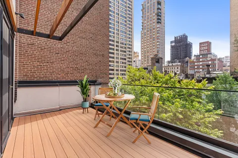 a view of a balcony with chairs