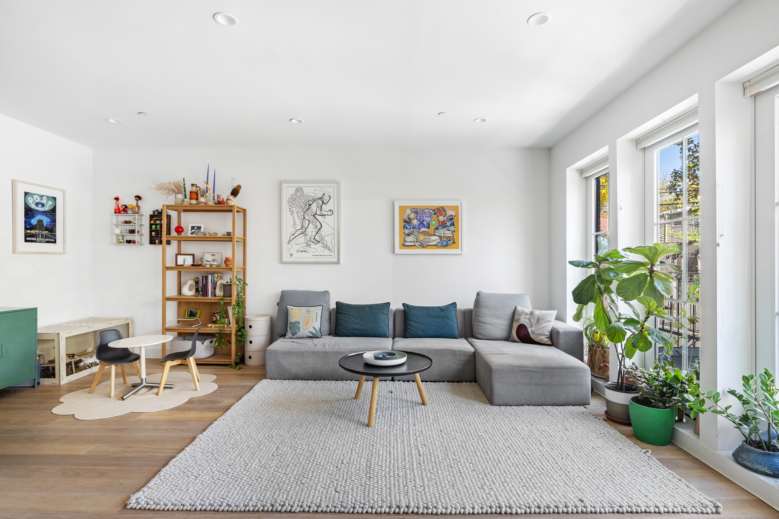 49 East 4th Street Brooklyn, NY 11218 - Photo 2 of 16 a living room with furniture and flowers