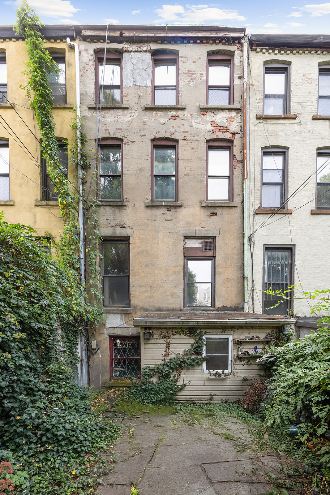 33 Park Place Brooklyn, NY 11217 - Photo 17 of 18 front view of a brick house with a large windows