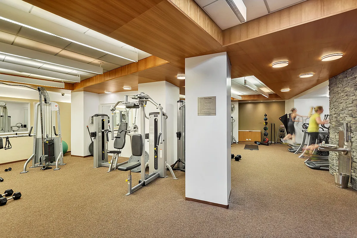 99 John Street, Unit 819 Manhattan, NY 10038 - Photo 10 of 20 a view of a room with gym equipment