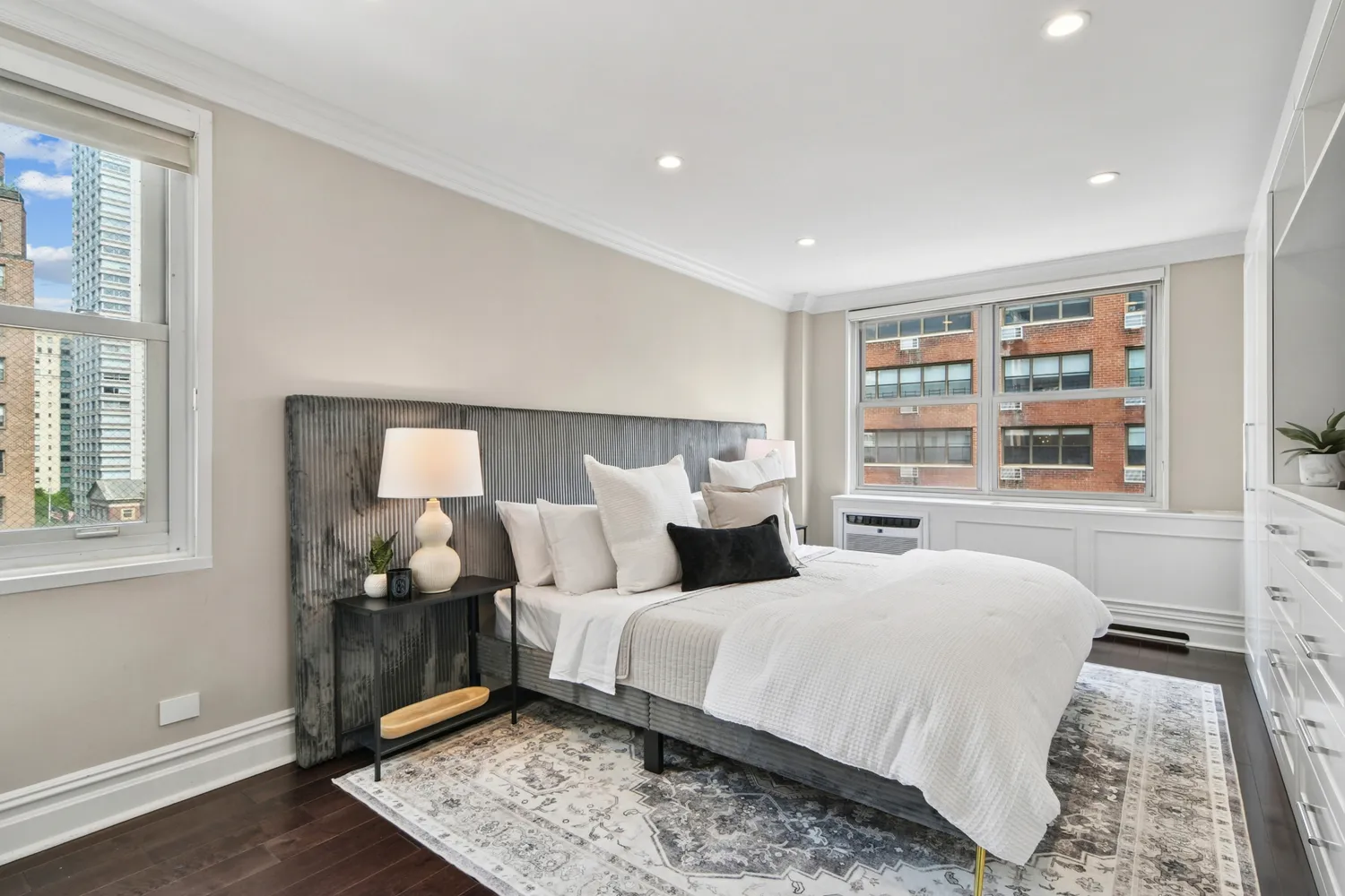 a bedroom with double bed and a window