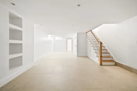 a view of an empty room with stairs