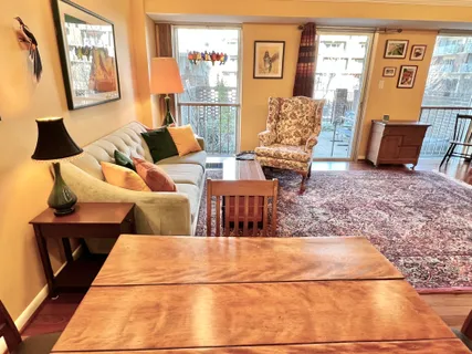 a view of a living room and wooden floor