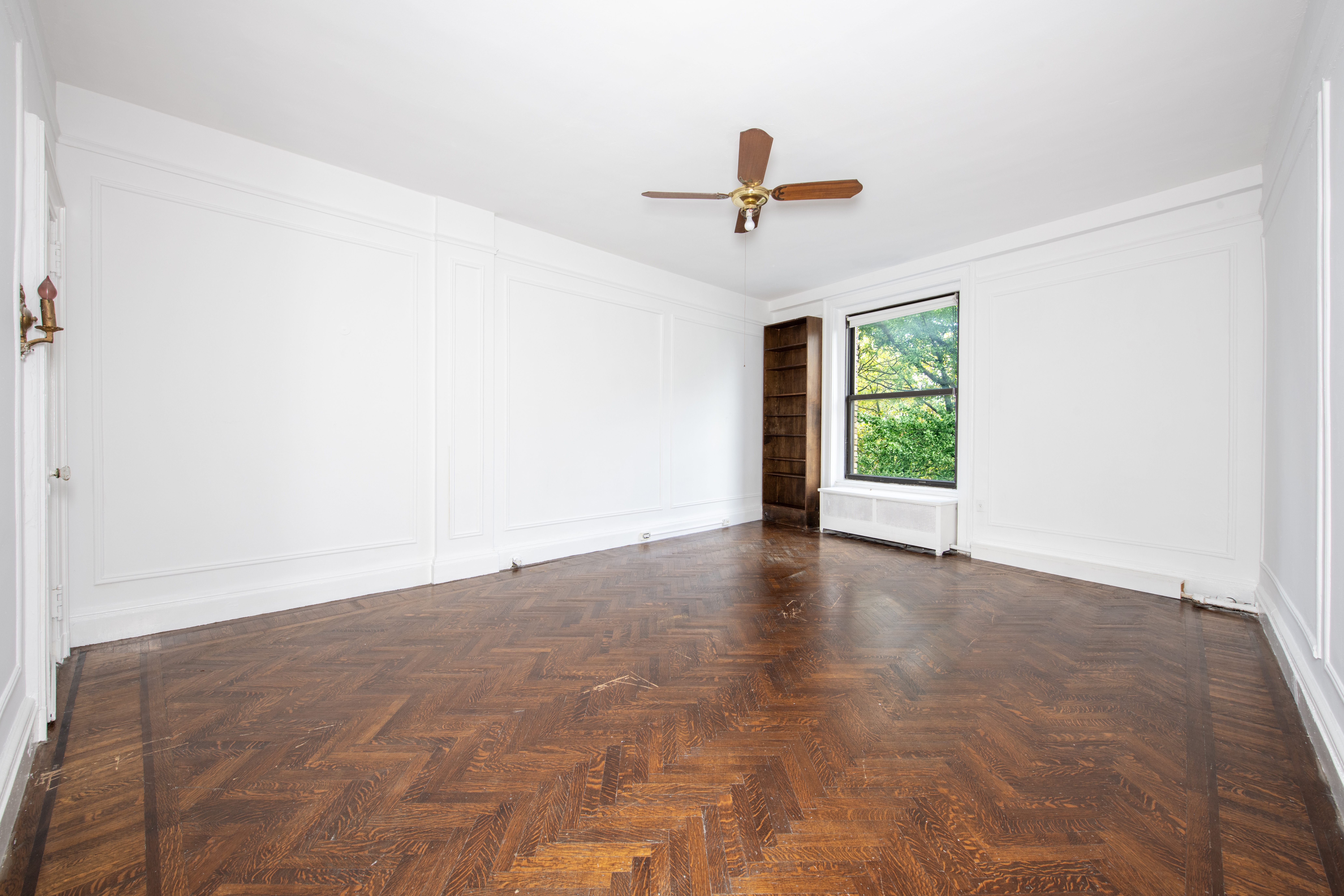 299 Riverside Drive, Unit 4D Manhattan, NY 10025 - Photo 6 of 15 a view of a livingroom with a ceiling fan and window
