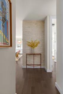 a view of staircase with a rug and a window
