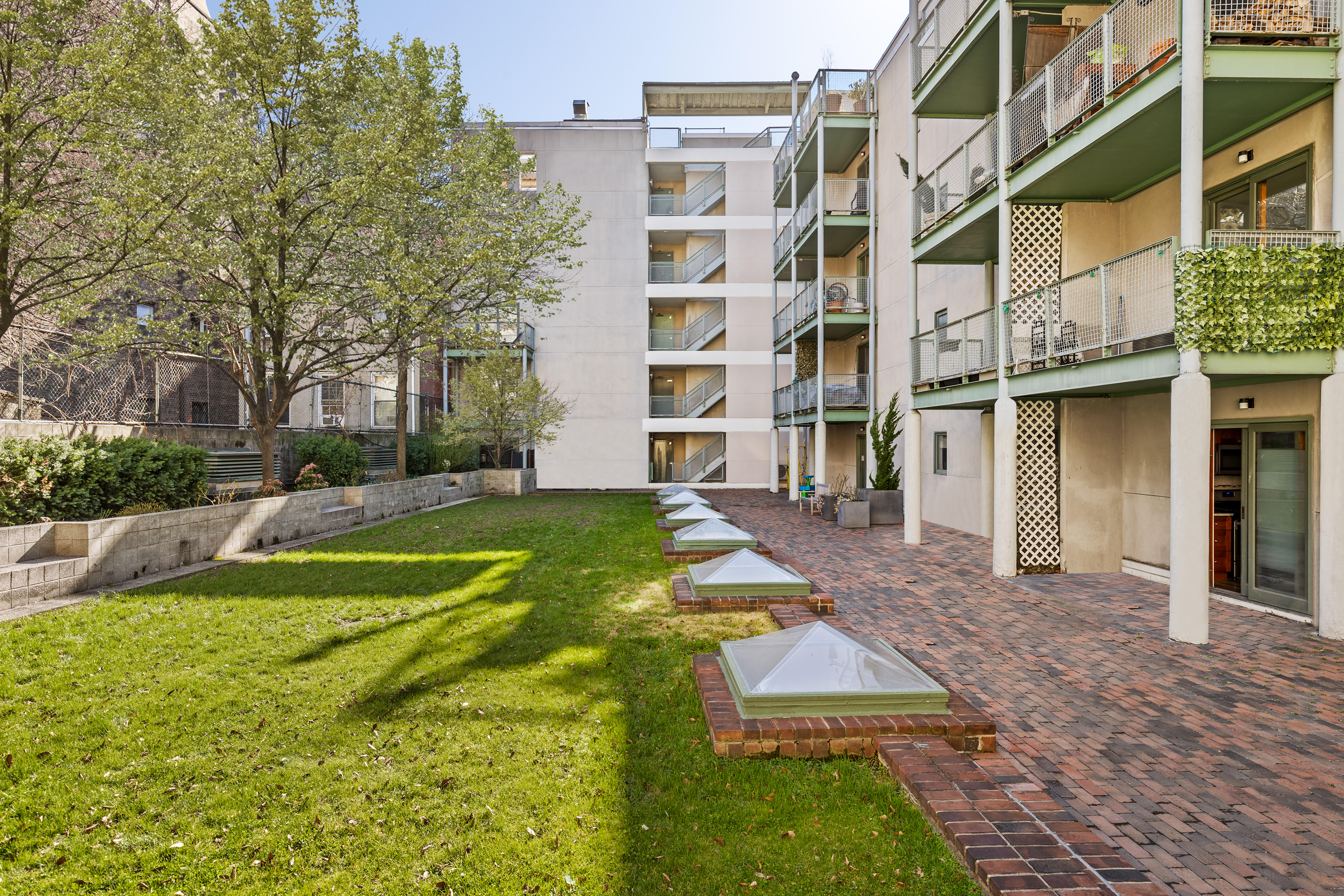 126 Waverly Place, Unit 2F Manhattan, NY 10011 - Photo 10 of 11 a view of a building with a yard