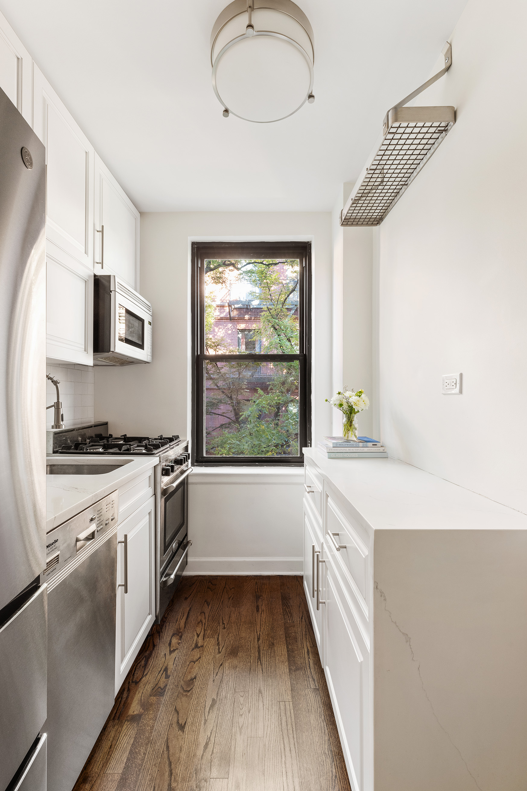 81 Bedford Street, Unit 4B Manhattan, NY 10014 - Photo 10 of 15 a large kitchen with a window
