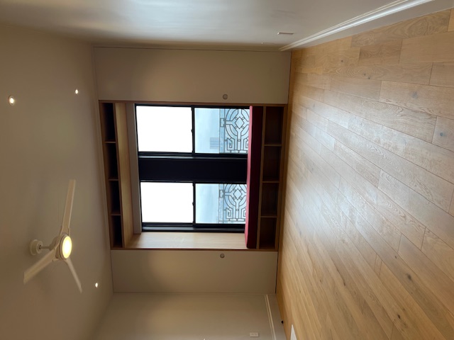 265 Riverside Drive, Unit 11F Manhattan, NY 10025 - Photo 7 of 18 an empty room with wooden floor and windows