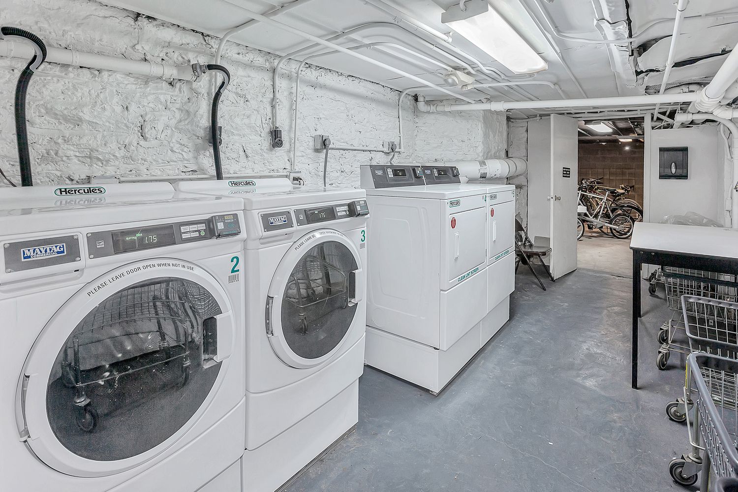 206 East 90th Street, Unit 2E Manhattan, NY 10128 - Photo 11 of 13 a utility room with dryer and washer