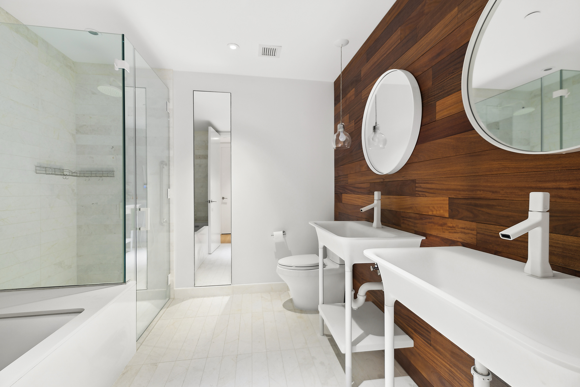 241 5th Avenue, Unit 4B Manhattan, NY 10016 - Photo 6 of 12 a bathroom with a sink a mirror and a toilet