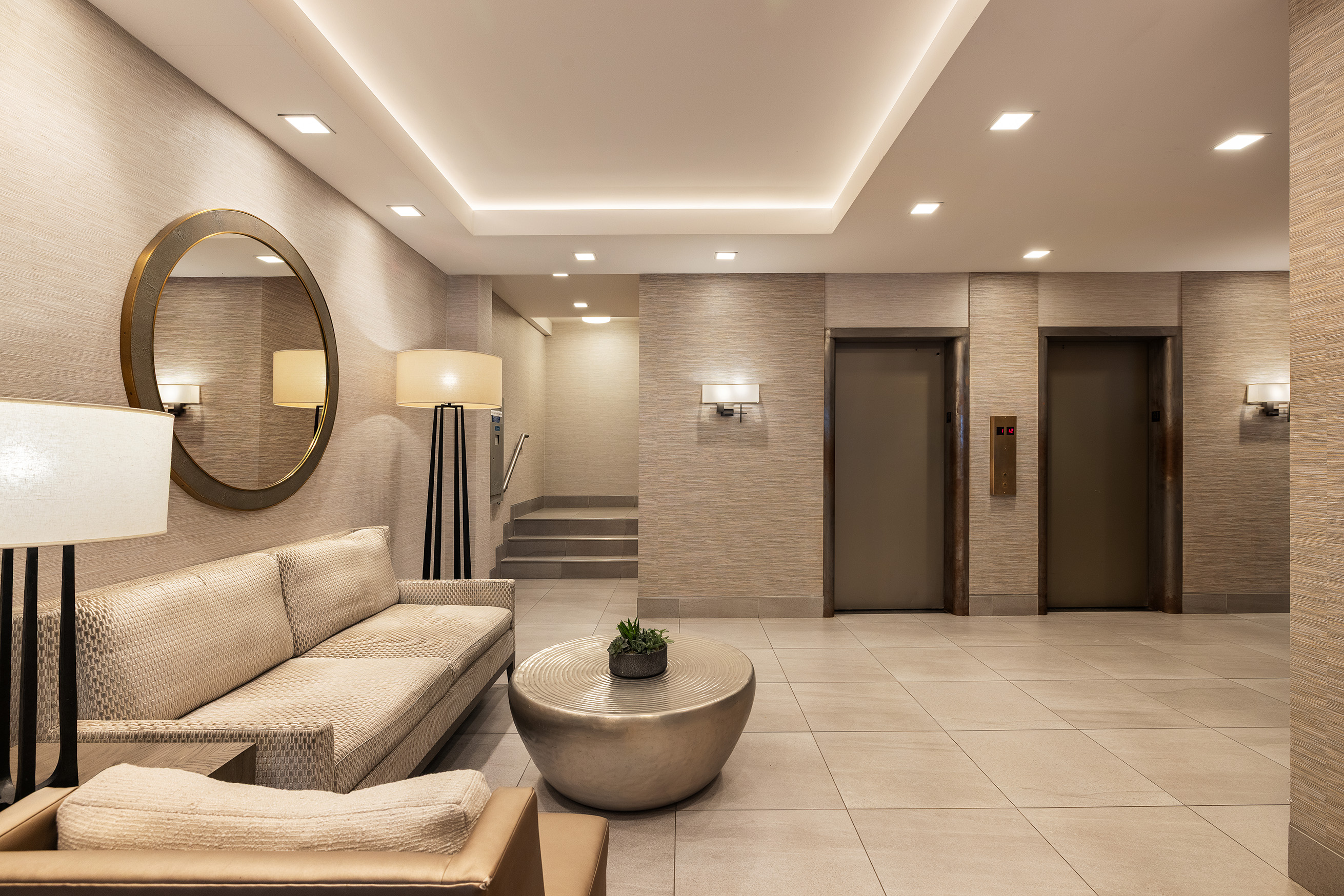 135 East 83rd Street, Unit 14B Manhattan, NY 10028 - Photo 14 of 16 a living room with furniture and a wooden floor