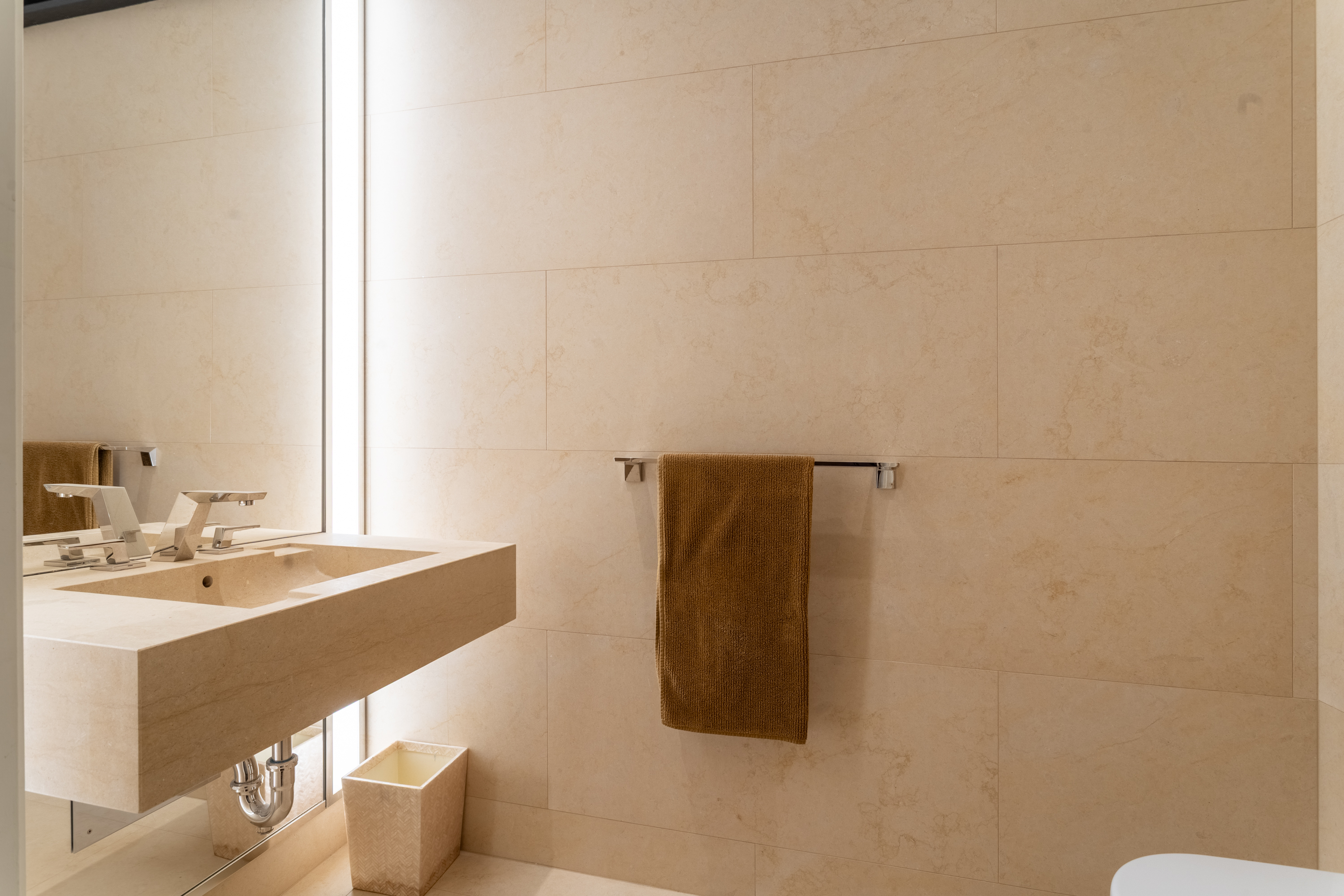 53 West 53rd Street, Unit 20E Manhattan, NY 10019 - Photo 10 of 11 a bathroom with a sink and a mirror