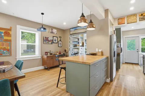 a view of a hallway with furniture and entryway