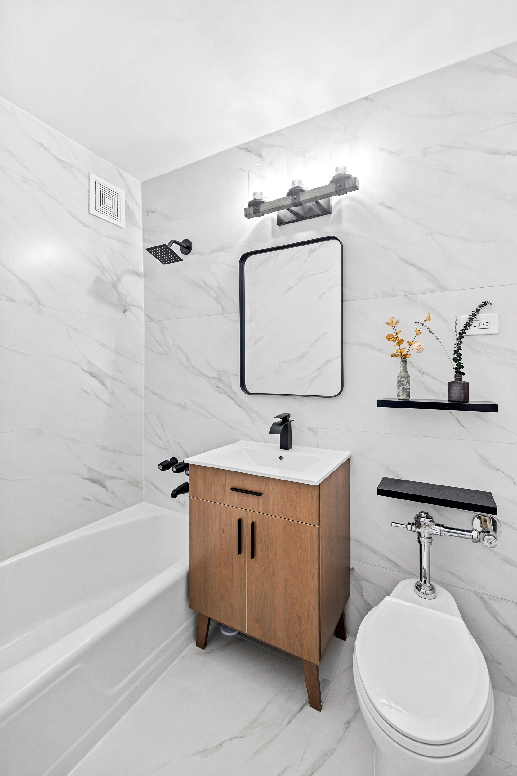 495 East 7th Street, Unit 7D Brooklyn, NY 11218 - Photo 5 of 9 a bathroom with a toilet a sink and bathtub