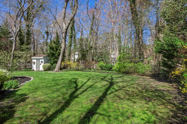 an aerial view of a houses with a yard