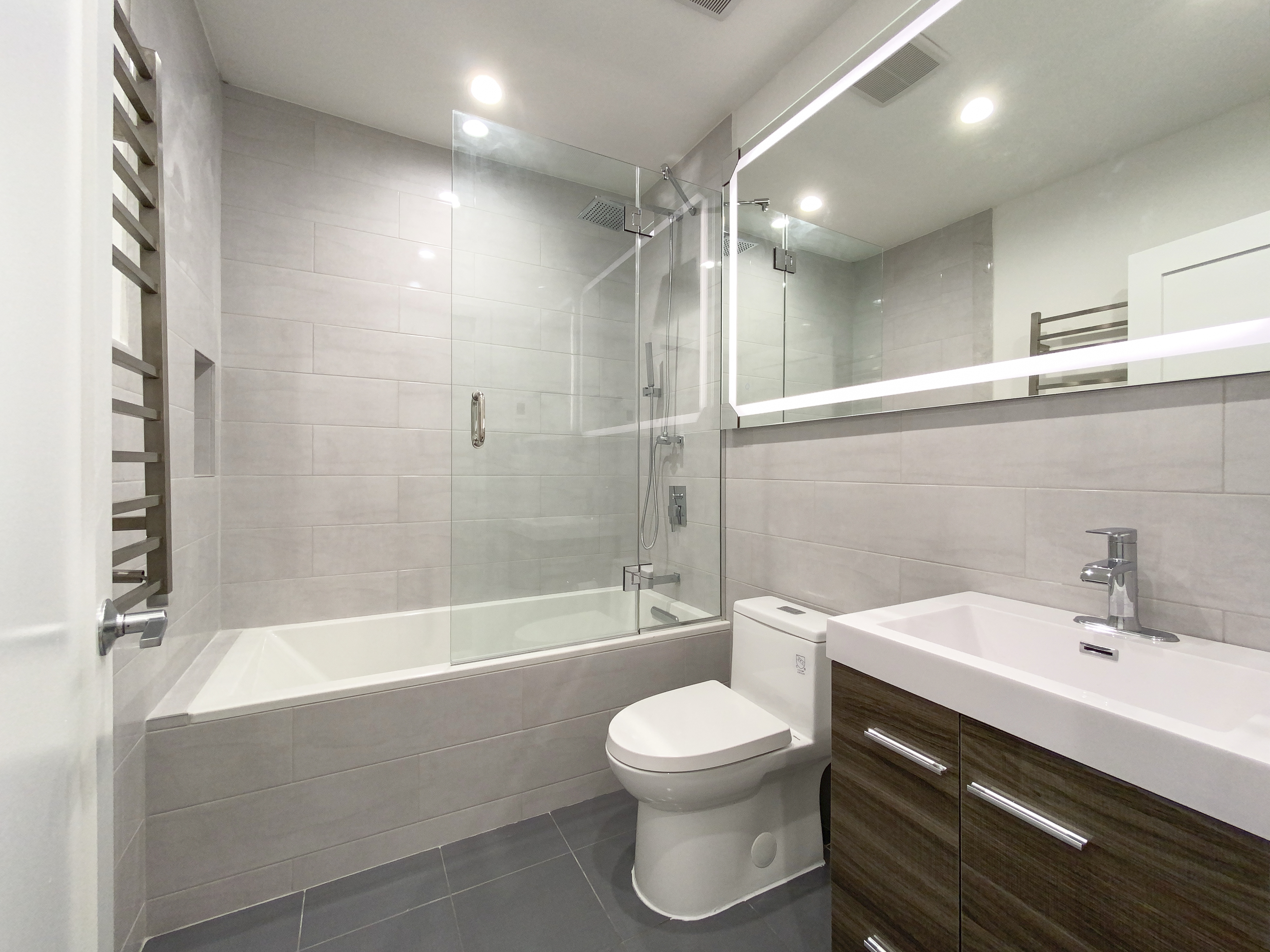 200 West 109th Street, Unit E4 Manhattan, NY 10025 - Photo 9 of 13 a bathroom with a sink a toilet and shower