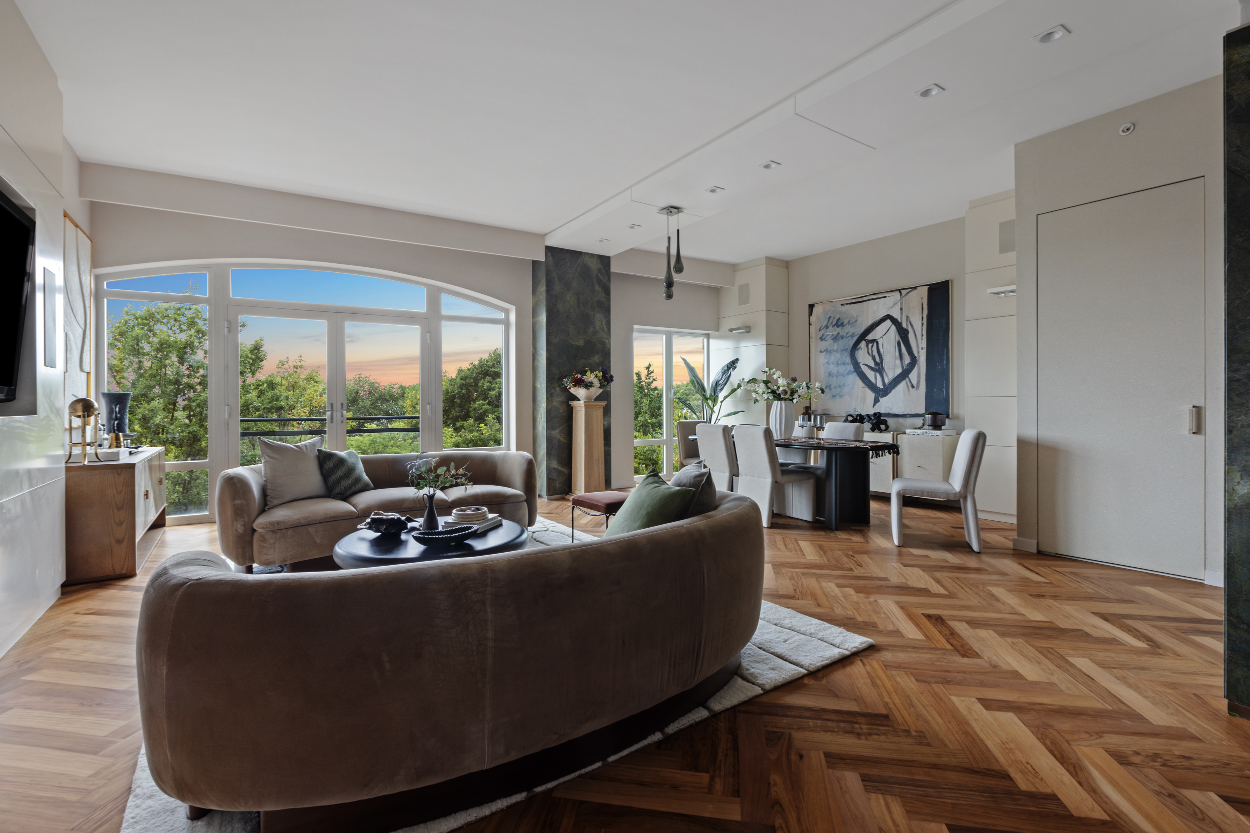 400 West 12th Street, Unit 4E Manhattan, NY 10014 - Photo 3 of 24 a living room with furniture and a large window