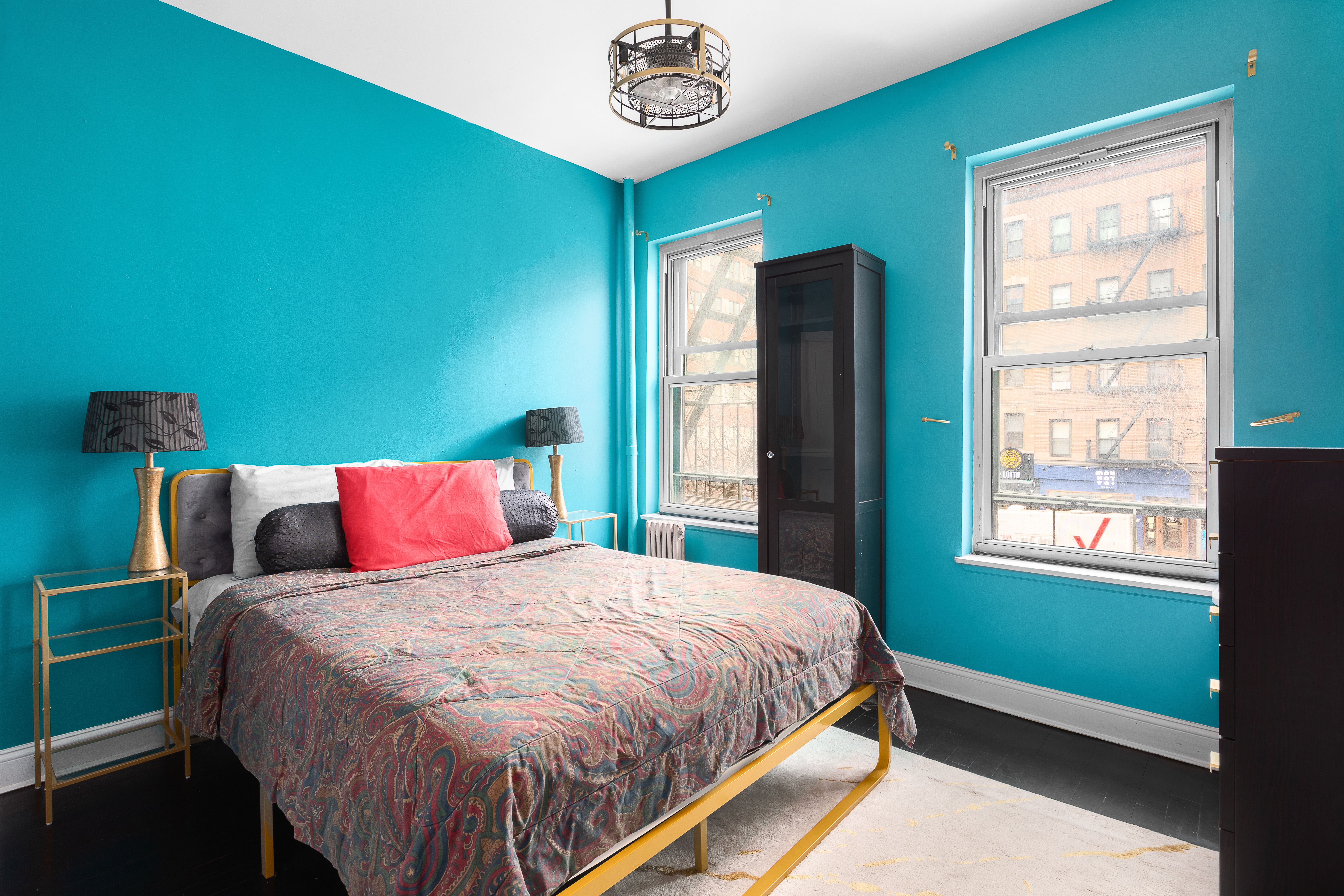 786 9th Avenue, Unit 2FN Manhattan, NY 10019 - Photo 4 of 6 a bedroom with a bed and a window