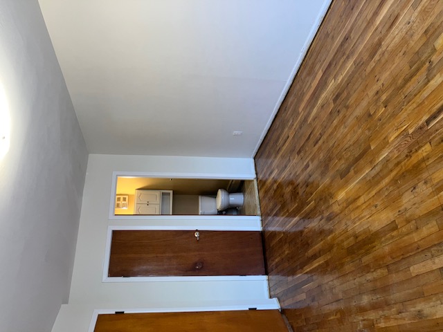 1653 West 9th Street, Unit 2 Brooklyn, NY 11223 - Photo 5 of 7 a view of an empty room with wooden floor and closet